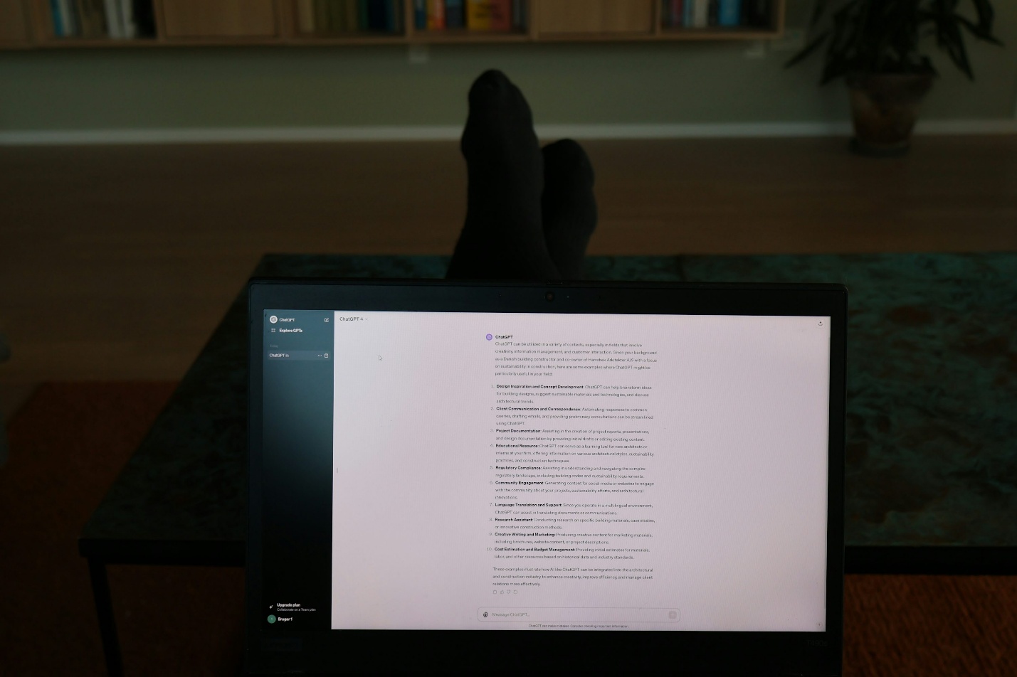 a person's feet resting on a computer screen