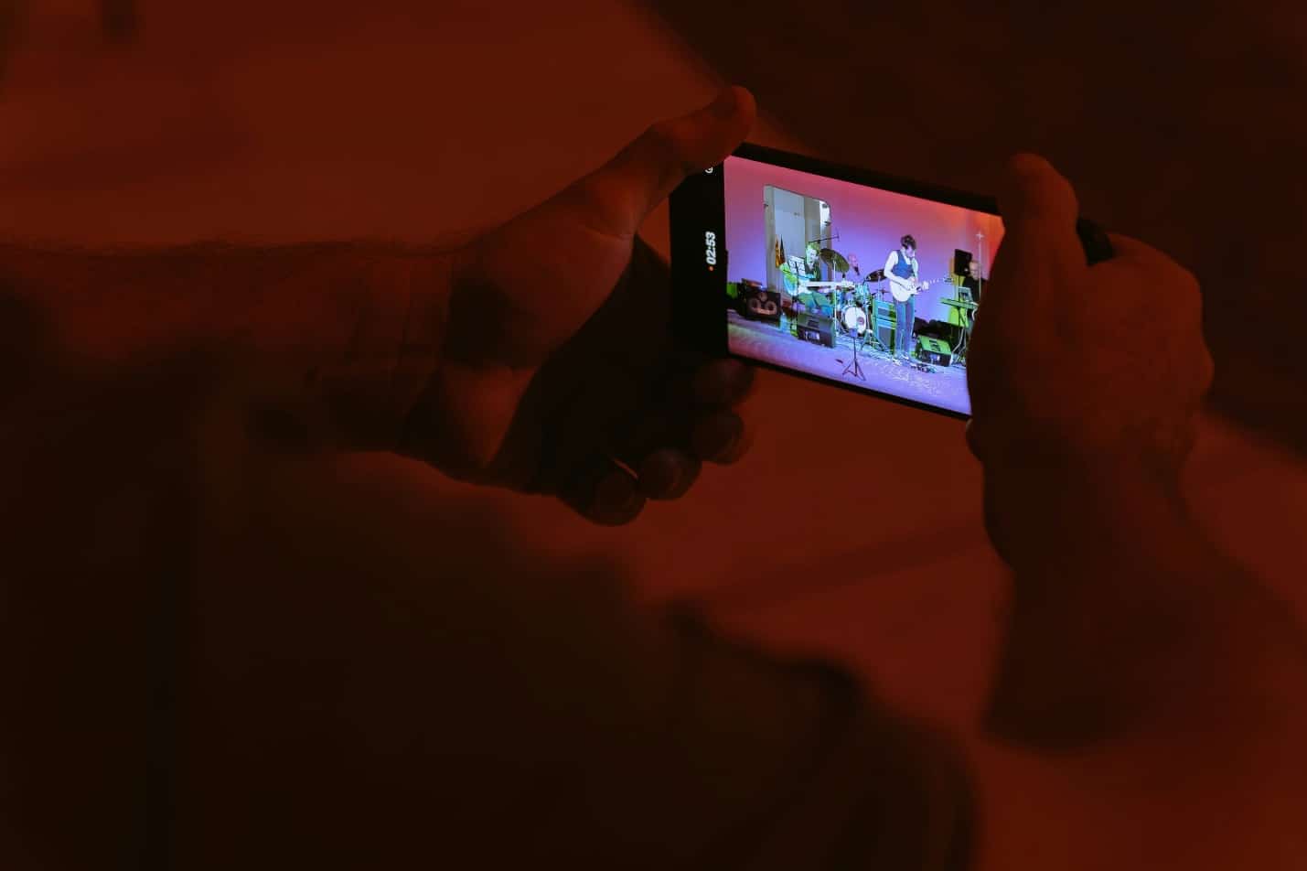 A person taking a picture with a cell phone