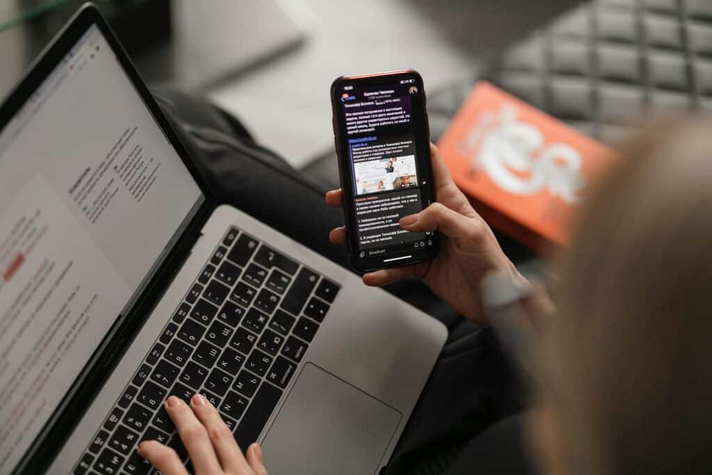 AMP Pages and the Google Search Experience Explained - SentiSight.ai Using internet search systems on a laptop and on a smartphone - artistic impression. Image credit: Maxim Ilyahov via Unsplash, free license