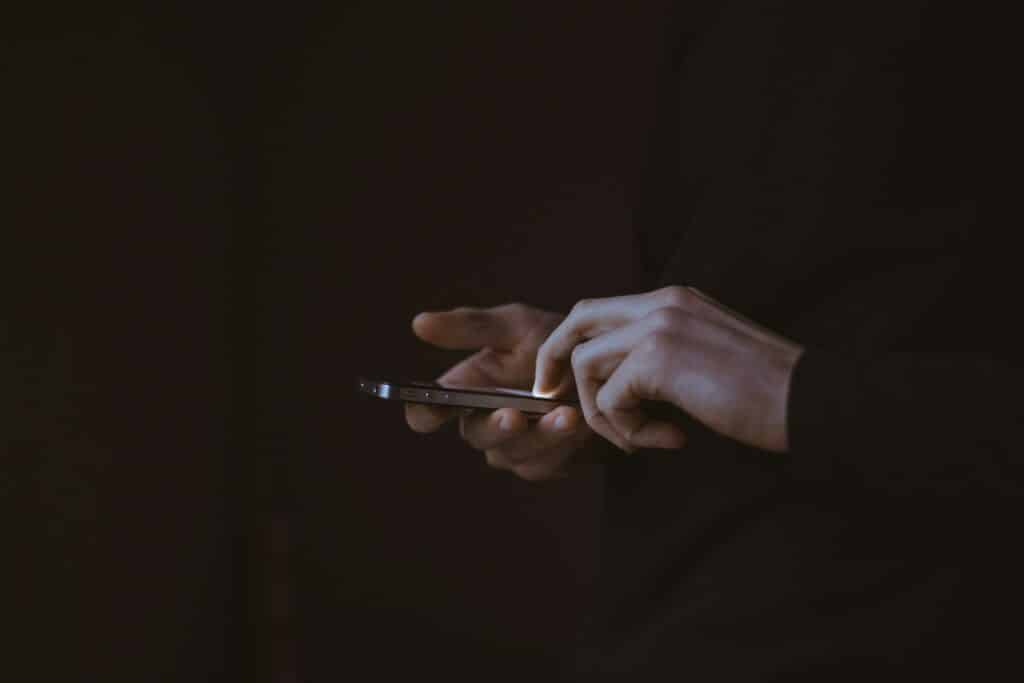 UI Pattern Recognition: What Thousands of App Screens Reveal About Design Trends - SentiSight.ai Using a smartphone - artistic impression. Image credit: Gilles Lambert via Unsplash, free license