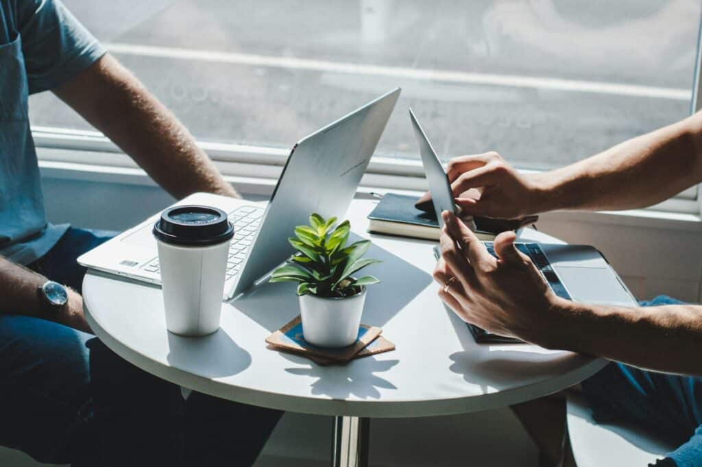 7 "Big Business" Practices That Startups Should Emulate - SentiSight.ai Two businessman - artistic impression. Image credit: Maranda Vandergriff via Unsplash, free license